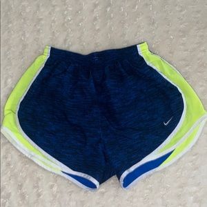 Blue and neon yellow Nike shorts